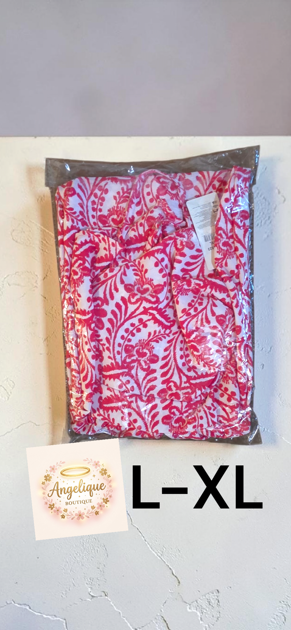 Vestido largo con estampado floral, escote en V y detalle retorcido en la parte delantera.